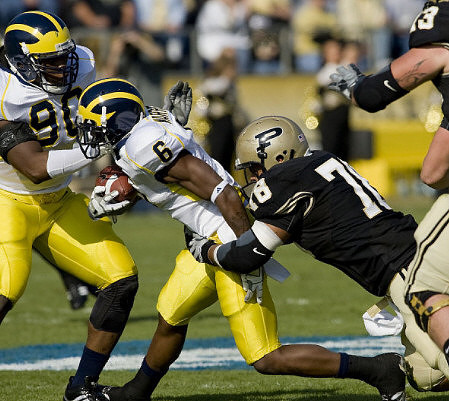 Donovan Warren (6) and Tim Jamison (90)