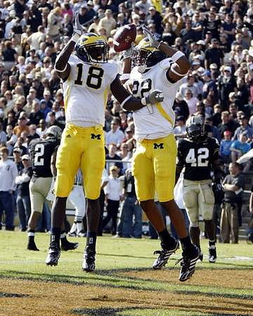 James Rogers (18) and Darryl Stonum (22)