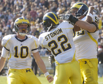 Steven Threet (10), Darryl Stonum (22), and Stephen Schilling (52)