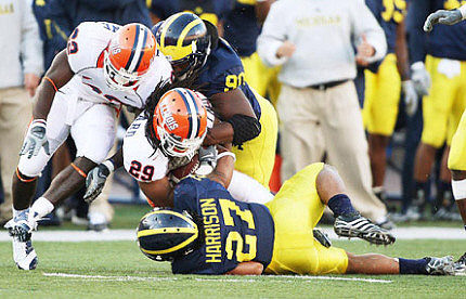 Brandon Harrison (27) and Tim Jamison (90)