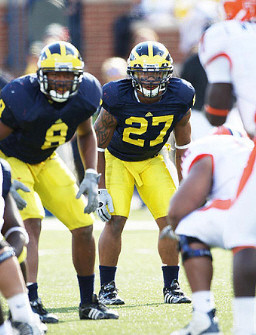 Jonas Mouton (8) and Brandon Harrison (27)