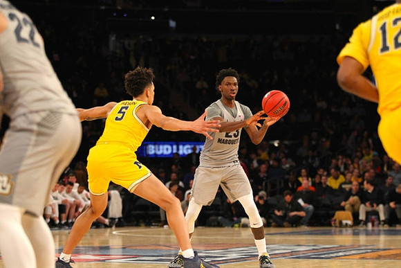 D.J. Wilson (5) and Muhammad-Ali Abdur-Rahkman (12)
