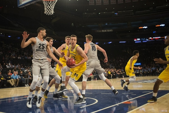 Moritz Wagner (13), Duncan Robinson (22), Ibi Watson (23), and Xavier Simpson (3)