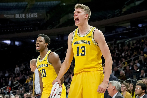 Derrick Walton Jr. (10) and Moritz Wagner (13)