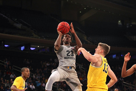 Muhammad-Ali Abdur-Rahkman (12) and Moritz Wagner (13)