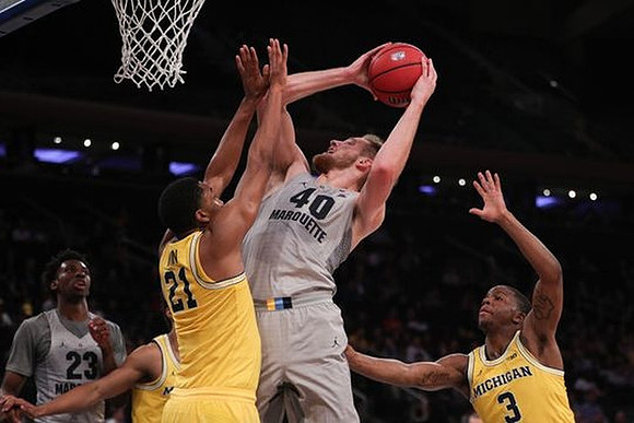 Zak Irvin (21) and Xavier Simpson (3)
