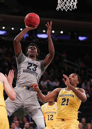 Muhammad-Ali Abdur-Rahkman (12) and Zak Irvin (21)