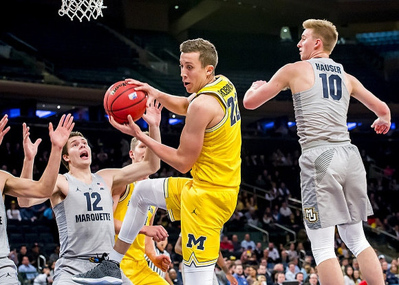 Moritz Wagner (13) and Duncan Robinson (22)
