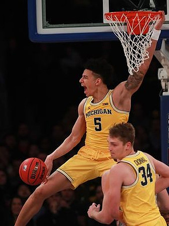 D.J. Wilson (5) and Mark Donnal (34)