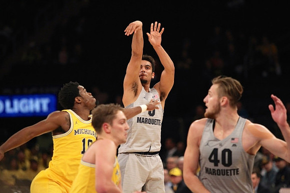 Derrick Walton Jr. (10) and Mark Donnal (34)