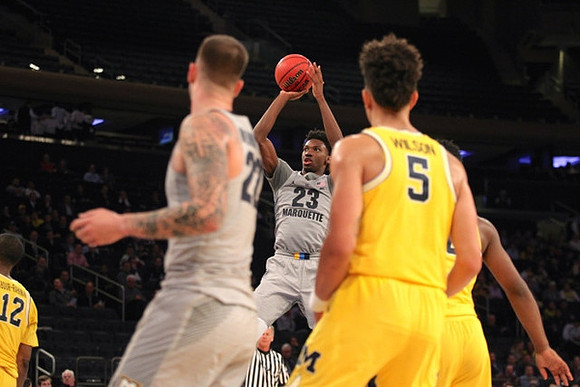 D.J. Wilson (5) and Muhammad-Ali Abdur-Rahkman (12)