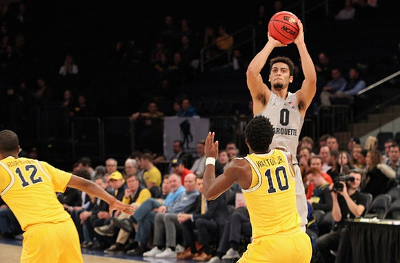 Muhammad-Ali Abdur-Rahkman (12) and Derrick Walton Jr. (10)