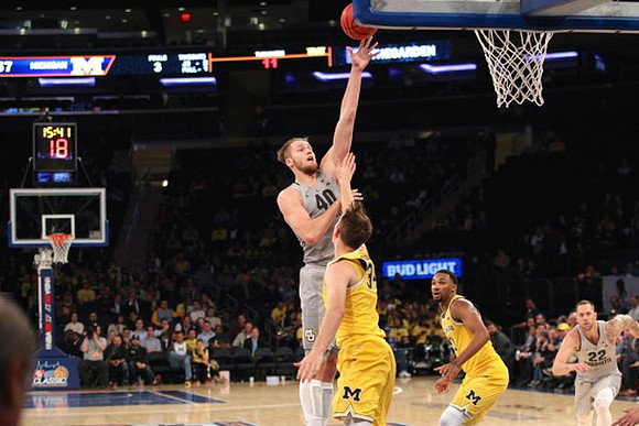Mark Donnal (34) and Zak Irvin (21)
