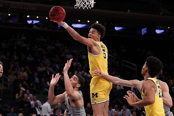 D.J. Wilson (5) and Ibi Watson (23)