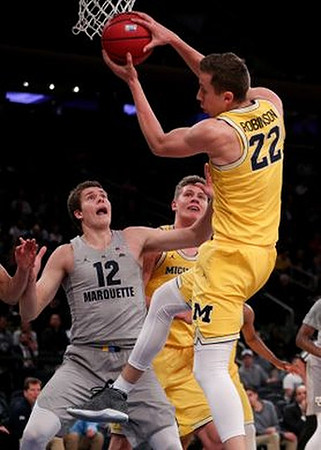 Moritz Wagner (13) and Duncan Robinson (22)