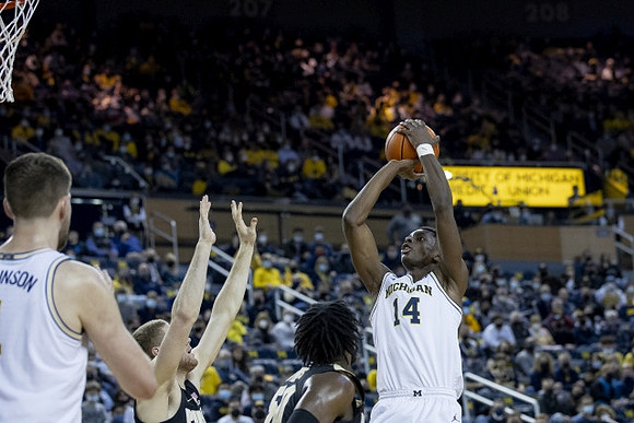 Hunter Dickinson (1) and Moussa Diabate (14)