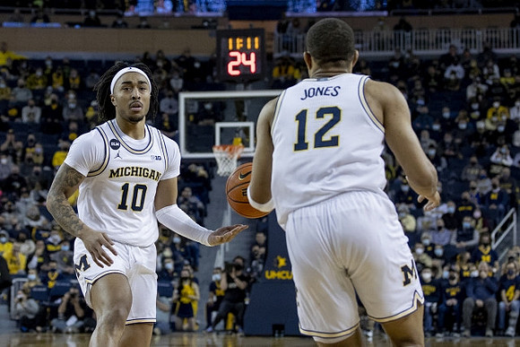 Frankie Collins (10) and DeVante' Jones (12)
