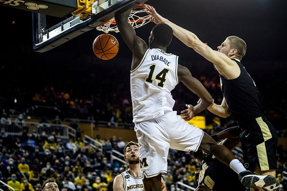 Hunter Dickinson (1) and Moussa Diabate (14)