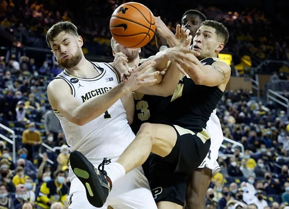 Hunter Dickinson (1) and Moussa Diabate (14)