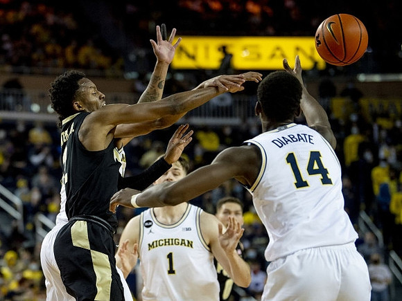 Hunter Dickinson (1) and Moussa Diabate (14)