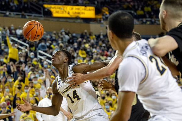 Moussa Diabate (14) and Caleb Houstan (22)