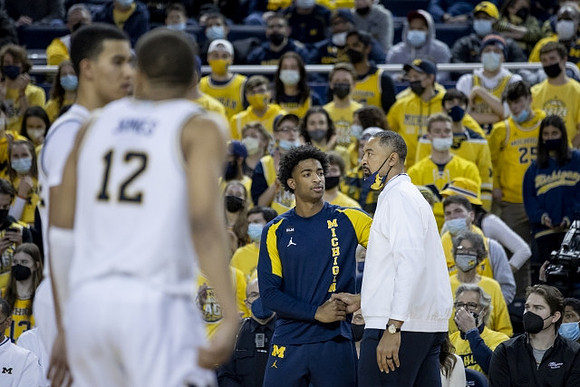 Caleb Houstan (22), DeVante' Jones (12), Jace Howard (25), and Juwan Howard
