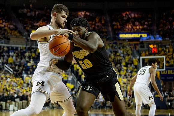 Hunter Dickinson (1) and Eli Brooks (55)