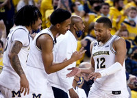 Frankie Collins (10), Kobe Bufkin (2), Saddi Washington, and DeVante' Jones (12)