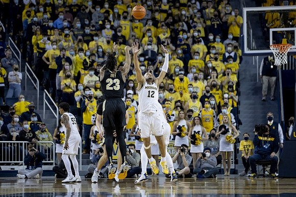 Terrance Williams II (5) and DeVante' Jones (12)
