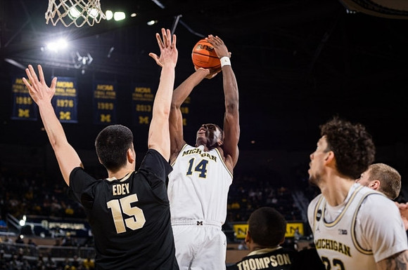 Moussa Diabate (14) and Brandon Johns Jr. (23)