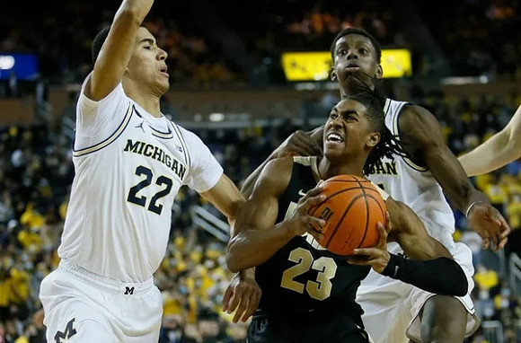 Caleb Houstan (22) and Moussa Diabate (14)