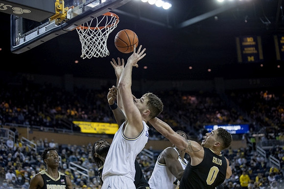 Hunter Dickinson (1) and Moussa Diabate (14)