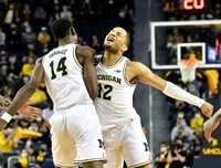 Moussa Diabate (14) and DeVante' Jones (12)