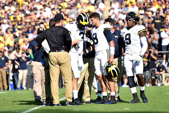 Jim Harbaugh, Wilton Speight (3), John O'Korn (8), and Donovan Peoples-Jones (9)