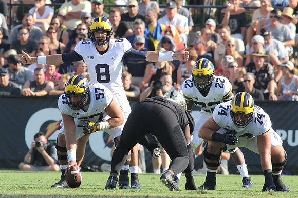 Patrick Kugler (57), John O'Korn (8), Karan Higdon (22), and Ben Bredeson (74)