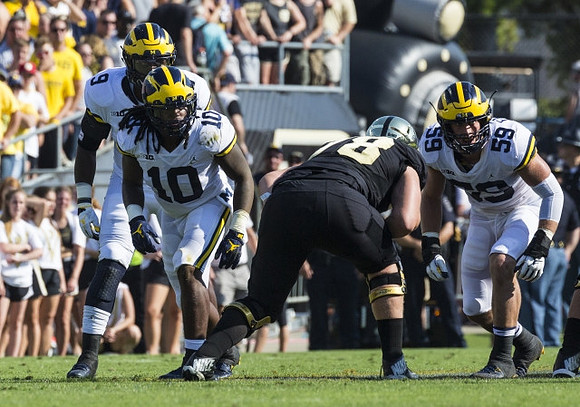 Mike McCray (9), Devin Bush (10), and Noah Furbush (59)