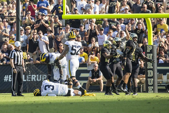 Wilton Speight (3), Michael Onwenu (50), and Mason Cole (52)