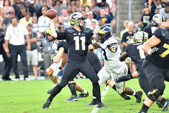 Chase Winovich (15) and Maurice Hurst (73)