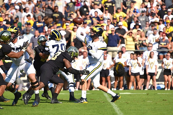 Mason Cole (52), Nolan Ulizio (70), and Wilton Speight (3)