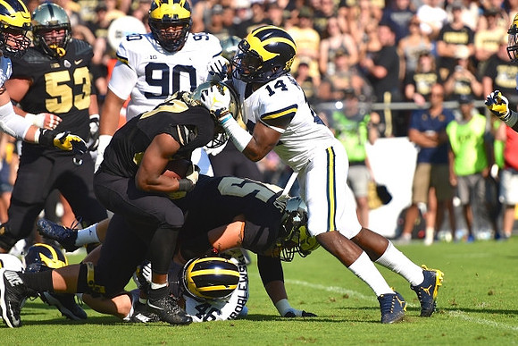 Bryan Mone (90), Michael Wroblewski (46), and Josh Metellus (14)