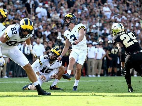 Zach Gentry (83), Garrett Moores (15), and Quinn Nordin (3)