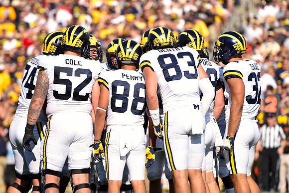 Ben Bredeson (74), Mason Cole (52), Grant Perry (88), Zach Gentry (83), Henry Poggi (19), and Ty Isaac (32)