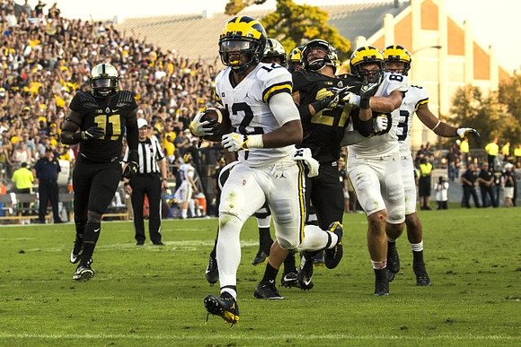 Chris Evans (12) and Zach Gentry (83)