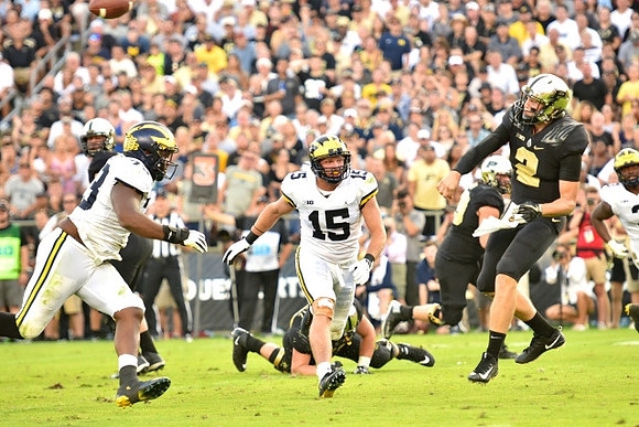 Maurice Hurst (73) and Chase Winovich (15)