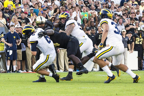 John O'Korn (8), Mason Cole (52), and Ty Isaac (32)