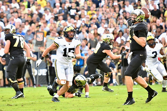 Chase Winovich (15) and Rashan Gary (3)