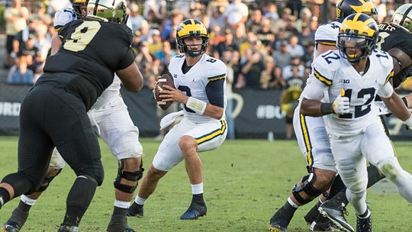 John O'Korn (8), Chris Evans (12), and Ben Bredeson (74)