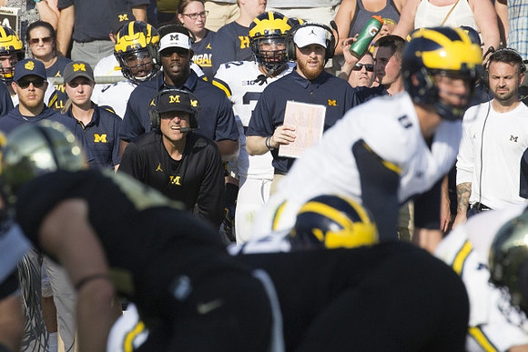Jim Harbaugh, John O'Korn (8), and Jay Harbaugh