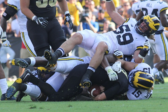 Noah Furbush (59), Chase Winovich (15), and Lavert Hill (24)