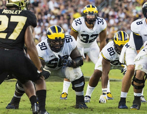 Michael Onwenu (50), Ty Isaac (32), Khalid Hill (80), and John O'Korn (8)
